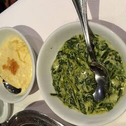 Garlic mashed potatoes and creamed spinach as sides
