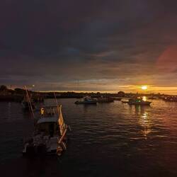 Sunset in the harbor of Sea lion in Puerto Baquerizo Moreno