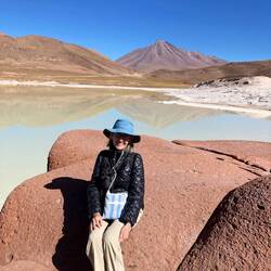 On a red rock by a salt flat