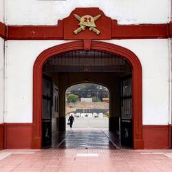 Peeking through the barracks gate to the parade ground ... 21st Infantry training base — La Serena.