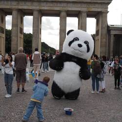 Dancing panda at the Brandenburg Gate.
