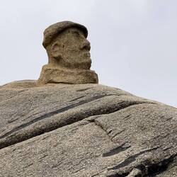 Neruda staring out at the Pacific Ocean from atop a boulder on the beach ... Isla Negra — El Quisco.