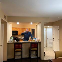 Kitchen complete with a male drinking a beer lol