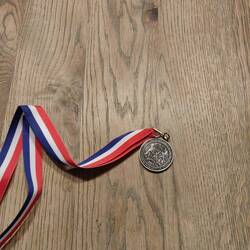 Eerste omnk medaille
