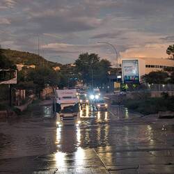 The road flooded by the temporary river.