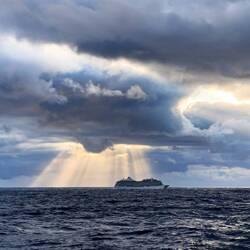 Big Sister Marina spotlighted by the sun's rays — Drake Passage.