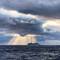Big Sister Marina spotlighted by the sun's rays — Drake Passage.