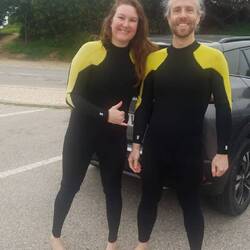 Dave and Emily getting ready to learn to surf