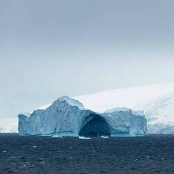 A big berg with an arch — Gerlache Strait, Antarctica.