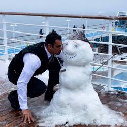 A butler gets cozy with the snowman that Ilya (production cast dancer) built — Dallman Bay.