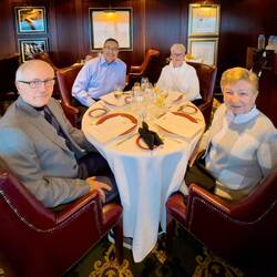 The four musketeers enjoying a special meal at the Polo Grill — RTW Dinner.