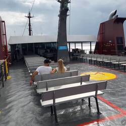 The sunny deck at the back of the 3rd floor. Nice railings to lean on.