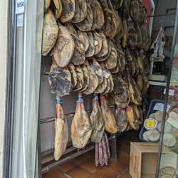 Wall of meat (Jamon) in a shop we passed