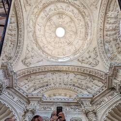 A ceiling of the church as seen through a mirror.