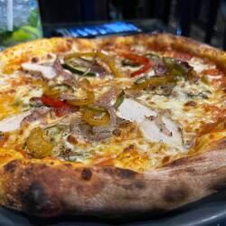 Craig had a tasty chicken pizza. The crust was yummy!