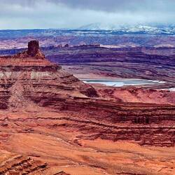 The snow capped mountains in the distance