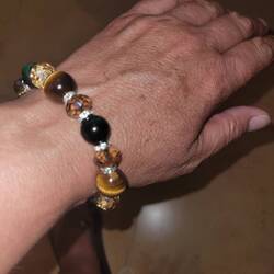My new bracelet. Tiger eye - brown and green, which I didn't know existed - and Swarovski crystals.