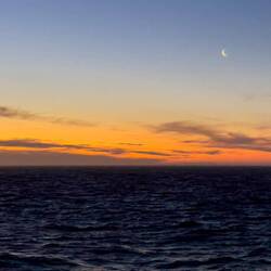 Sunset with the new moon — Atlantic Ocean ... Aboard Insignia.