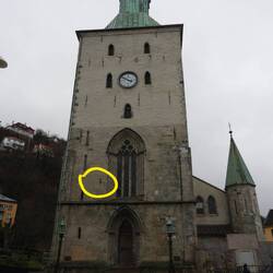 Cannonball (circled) in church wall