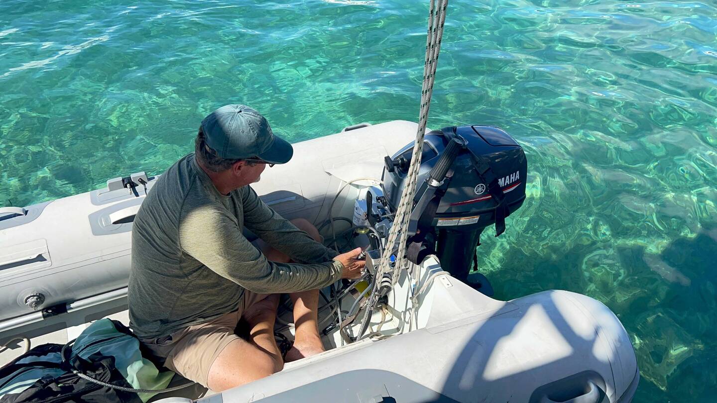 Putting in our new 2-stroke 15 HP Yamaha engine.