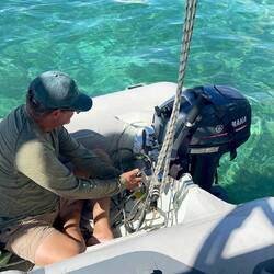 Putting in our new 2-stroke 15 HP Yamaha engine.
