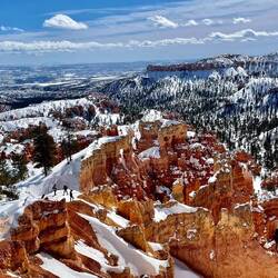 The people in the foreground give an indication the size of the canyon