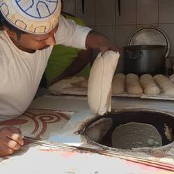 Rooti bread being baked in the tandoori