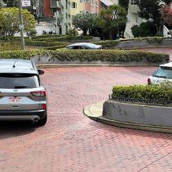 Some people hire cars just to drive Lombard Street
