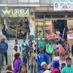 Many people hanging out on the streets .. some walked for hours a day to get to the city