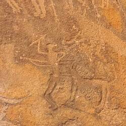 A hunter with Bow and arrow aided by dogs