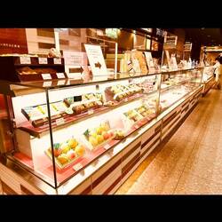 Grocery stores feature many counters of sweets, all beautifully presented and wrapped.