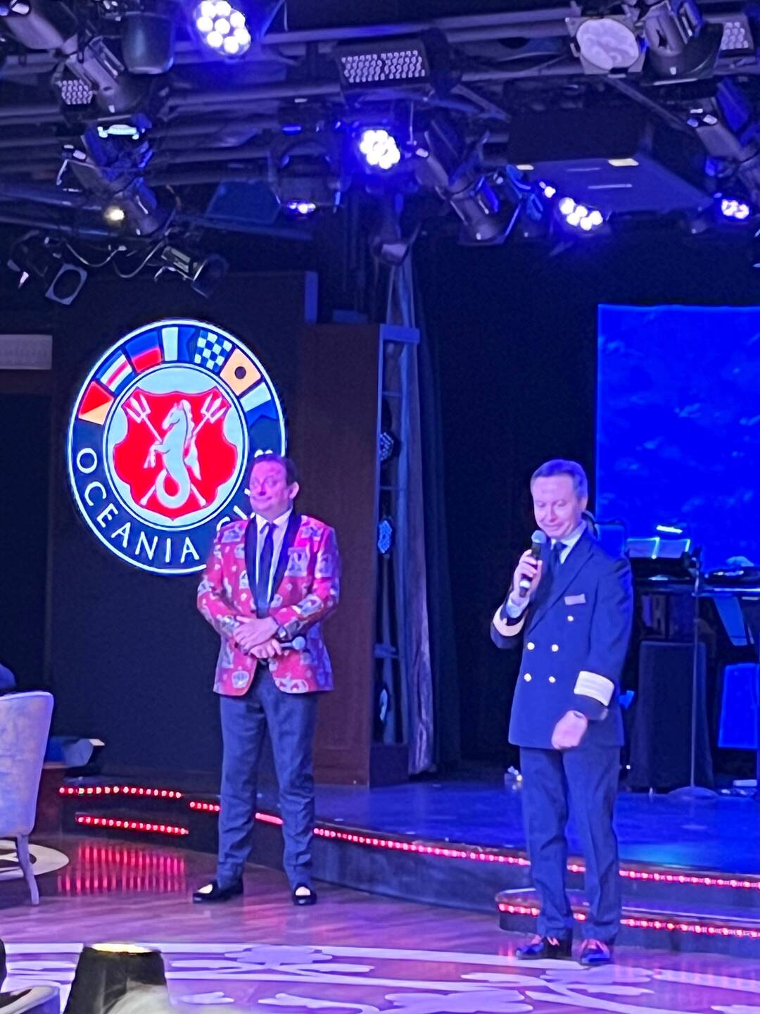 The ship's cruise director Ray (left) with general manager Claudio