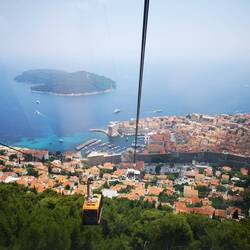 Riding a gondola to the top
