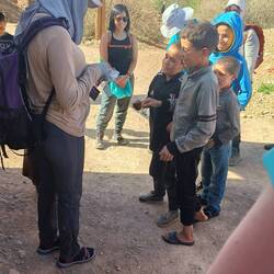 Chaman handing out pens to the local kids that one of the ladies brought to share