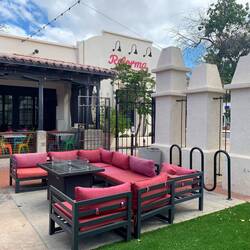 Outside seating with heaters by Reforma