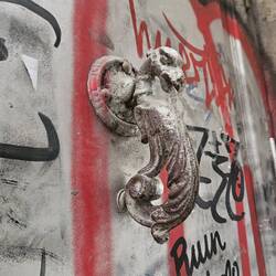 Street art around a door handle