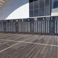 Welcome wall for immigrants of all eras with David Alan Bell aknowledged