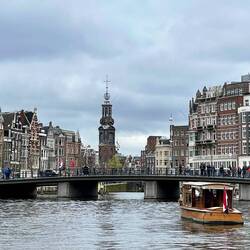 On a canal boat, old mint (tower) in background