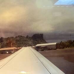 CO956 awaiting clearance to takeoff from PNI, with Sokehs Rock in the background.