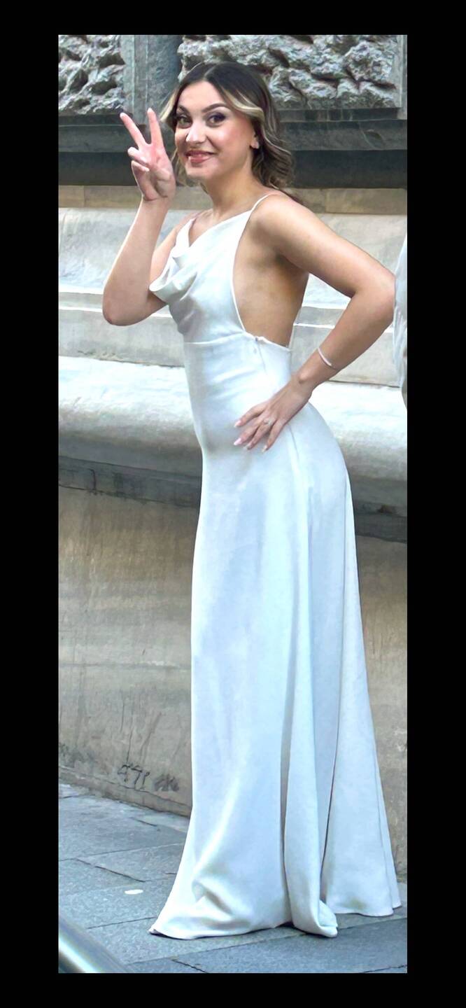One of the brides acknowledged this tourist taking her photo.