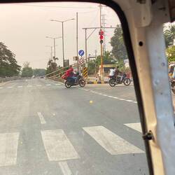 A LADDER being carried on a motorcycle!!