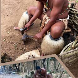 Keeping the fire going to make his knives