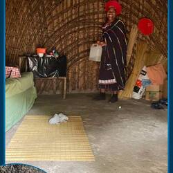 She invited Bruce in to visit her hut