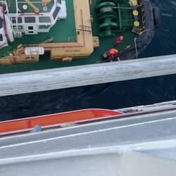 The pilot being picked up after sail away