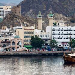 The pink arch marks the entrance to the Mutrah Souq — Muscat, Oman.