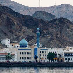 Cityscape along the Mutrah Corniche — Muscat, Oman.