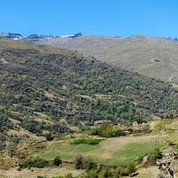 Small patches of snow on top of the mountains