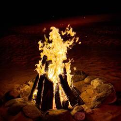 A fire that we didn't need since it never did get cold — Al Maha Luxury Resort Bedouin Camp.