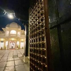 Spikes on the top half of the heavy entry gate doors