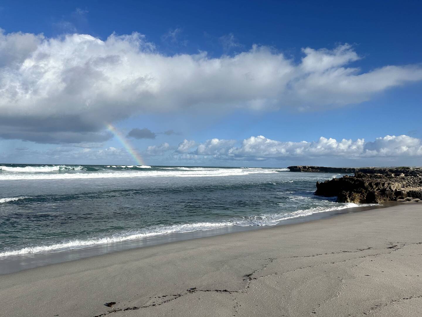 Rainbow leading to the surf spot ( Caves)